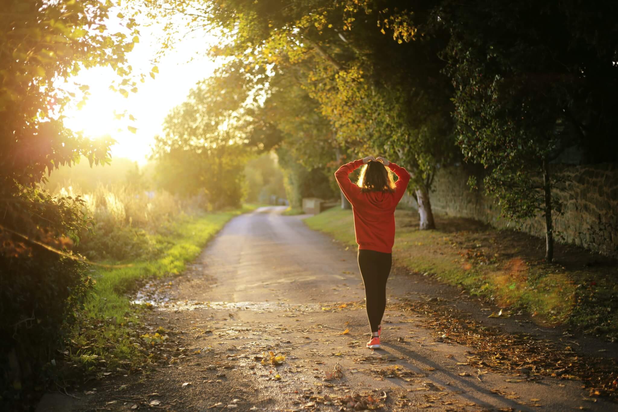 Woman Walking with Hand on Head