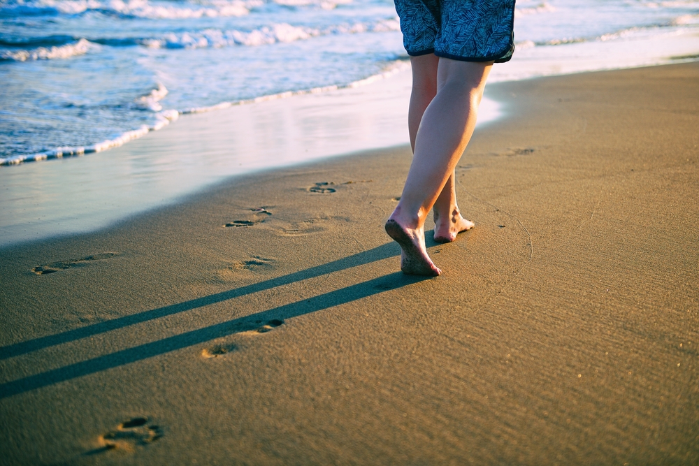 Barefoot grounding on the beach