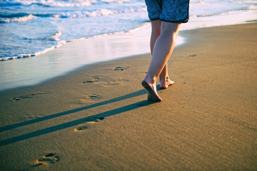 Barefoot grounding on the beach