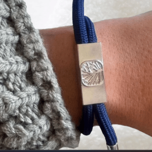 Informational graphic for Earthband PEMF Bracelet showcases infinity loops, hands holding a 7.83Hz globe, and icons. Highlights include the infinity loop design, Schumann resonance frequency, PEMF benefits, and continuous natural energy flow.