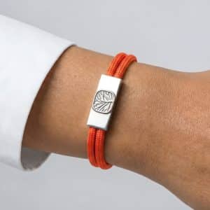 Informational graphic for Earthband PEMF Bracelet showcases infinity loops, hands holding a 7.83Hz globe, and icons. Highlights include the infinity loop design, Schumann resonance frequency, PEMF benefits, and continuous natural energy flow.