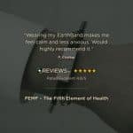 A close-up of a wrist wearing a braided black bracelet with a metal plate, overlaid with a customer review: Wearing my EarthBand makes me feel calm and less anxious. Would highly recommend it, and a five-star rating.